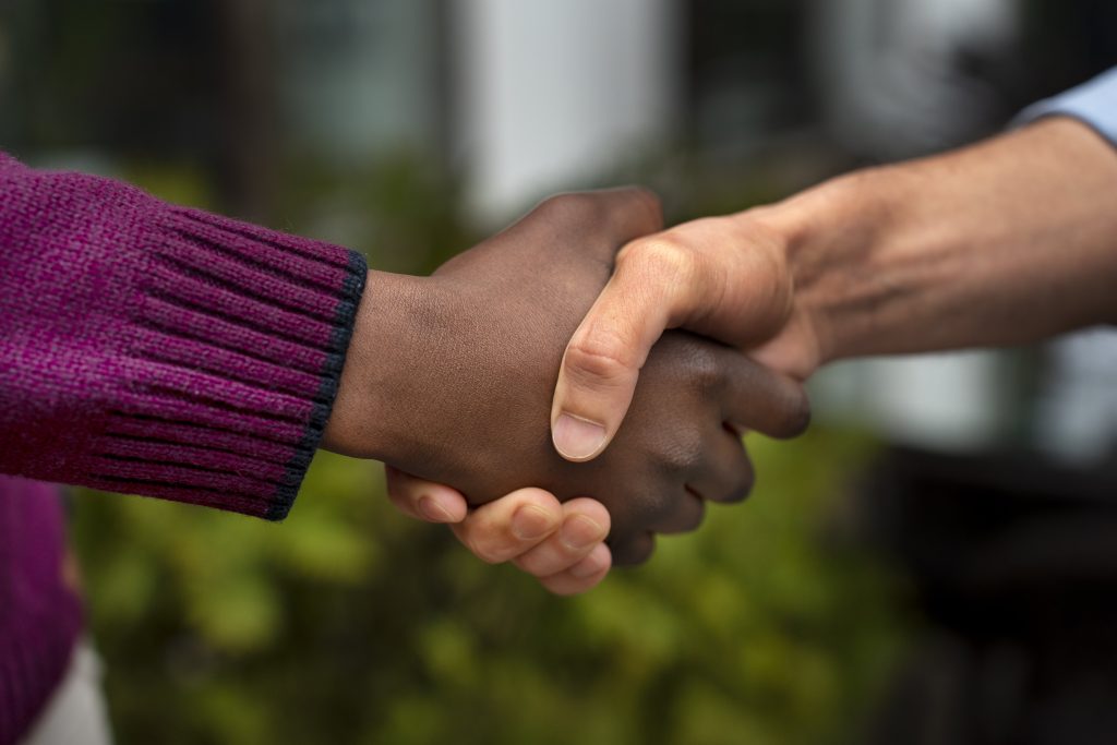 hands holding each other support min