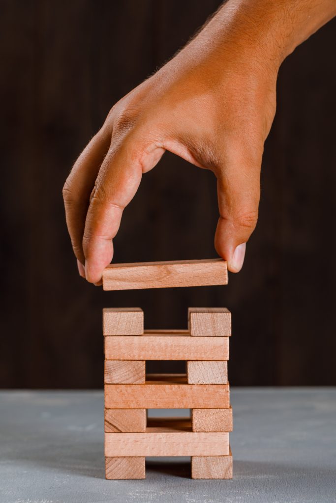 man building up tower min