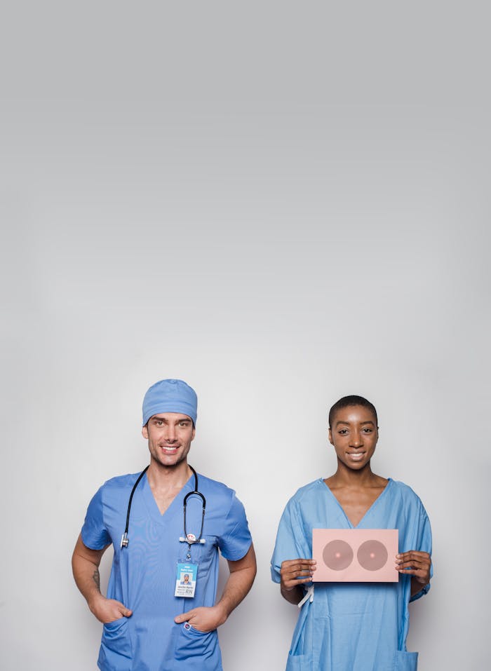 Two medical professionals promoting breast cancer awareness and healthcare solidarity.